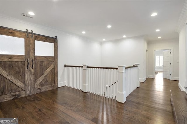 885 Crabapple Hl, Milton, GA 30004 - entryway with crown molding, a barn door, and dark hardwood / wood-style floors