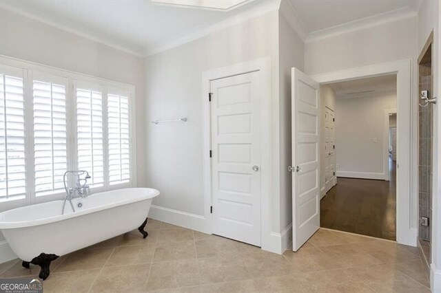 885 Crabapple Hl, Milton, GA 30004 - bathroom with tile patterned floors, ornamental molding, and a bathing tub