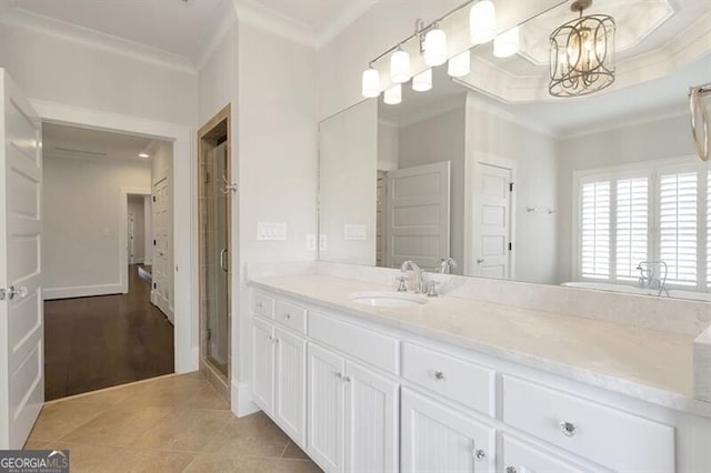 885 Crabapple Hl, Milton, GA 30004 - bathroom with crown molding, an enclosed shower, vanity, a notable chandelier, and tile patterned floors