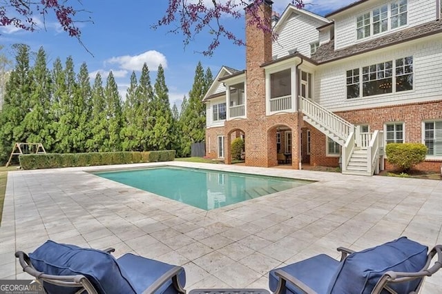 885 Crabapple Hl, Milton, GA 30004 - view of swimming pool with a patio area and a sunroom