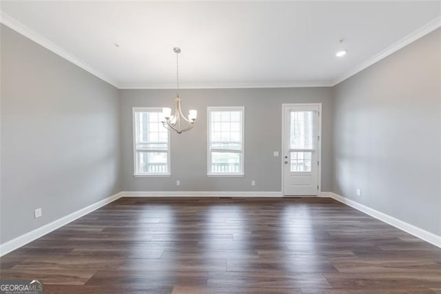 interior space featuring dark hardwood / wood-style flooring, an inviting chandelier, and ornamental molding