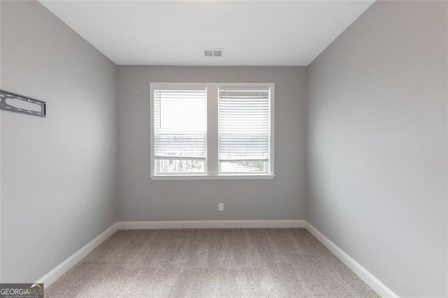 spare room with carpet floors