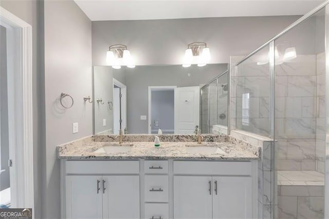 bathroom with vanity and an enclosed shower