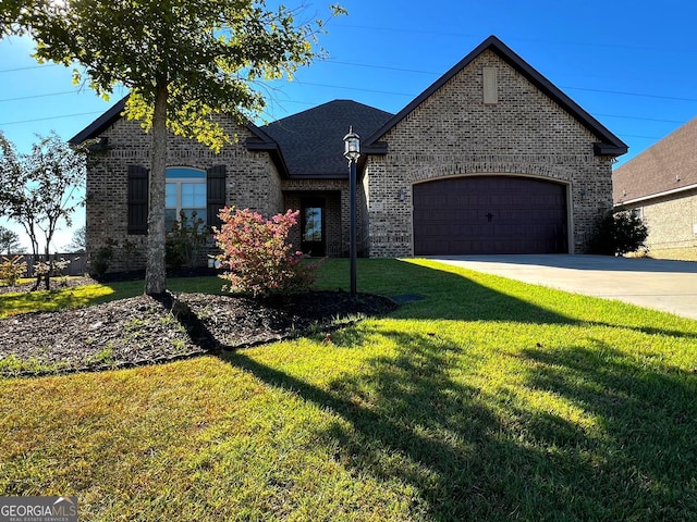 french country inspired facade featuring a garage and a front lawn