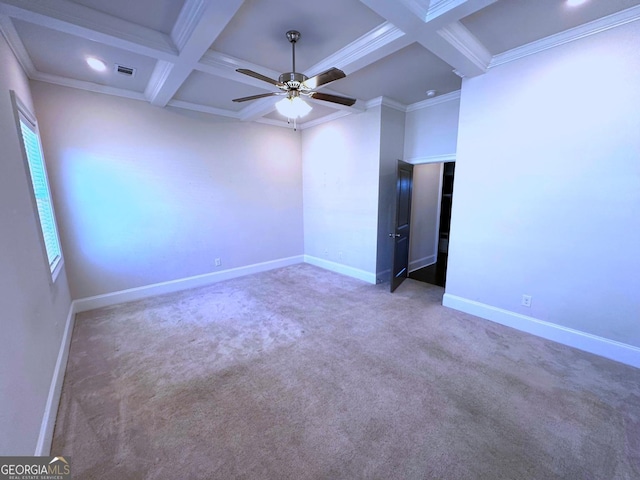 spare room with beamed ceiling, carpet floors, ornamental molding, coffered ceiling, and ceiling fan