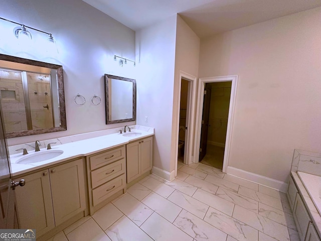 bathroom with vanity, toilet, and a shower with door