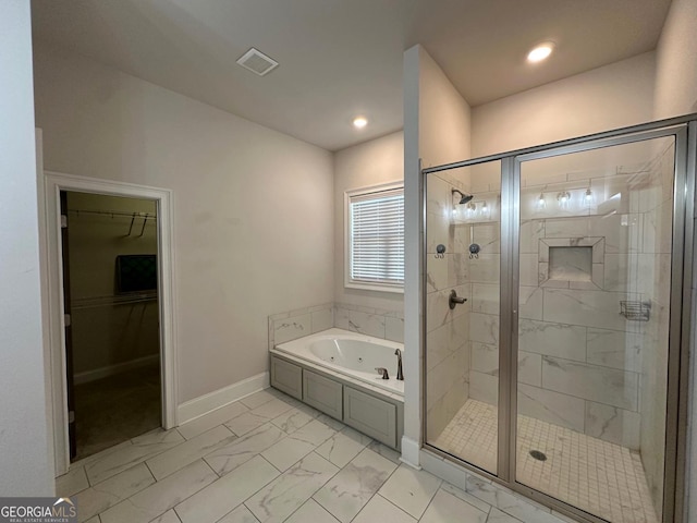 bathroom with shower with separate bathtub