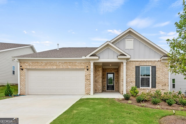 view of front of property featuring a front yard and a garage