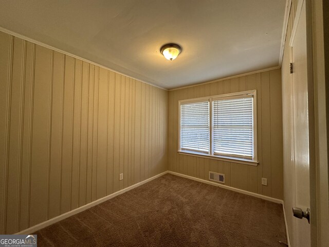 1581 Hollyhock Ter, Decatur, GA 30032 - empty room with ornamental molding, dark carpet, and baseboards