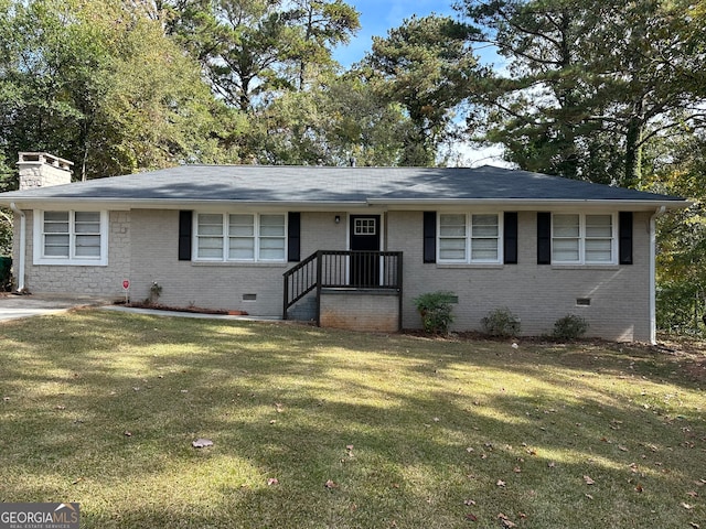 ranch-style home with a front lawn