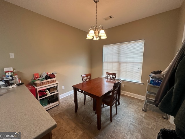 dining room with a notable chandelier