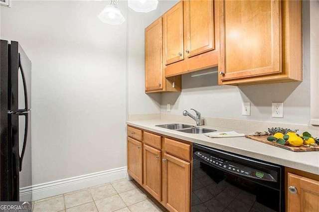 kitchen featuring light tile patterned floors, sink, and black appliances