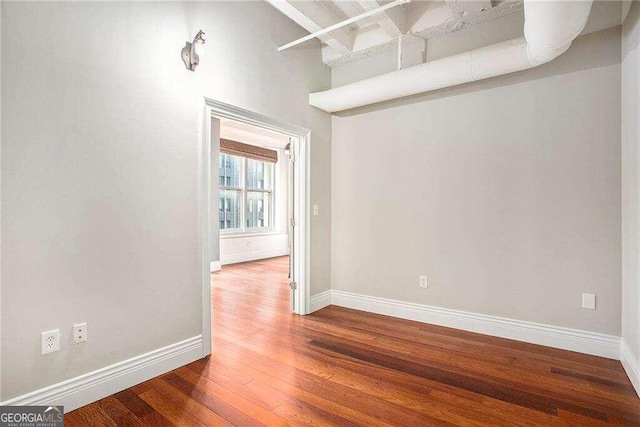 unfurnished room featuring wood-type flooring