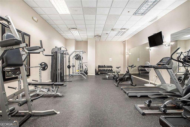 gym featuring a paneled ceiling