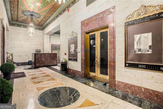 corridor with french doors and ornamental molding