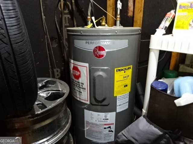 utility room featuring electric water heater