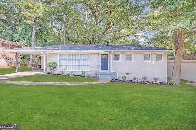 ranch-style home with a carport and a front yard