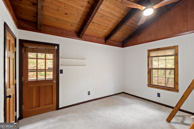 interior space featuring light colored carpet, plenty of natural light, wood ceiling, and lofted ceiling with beams