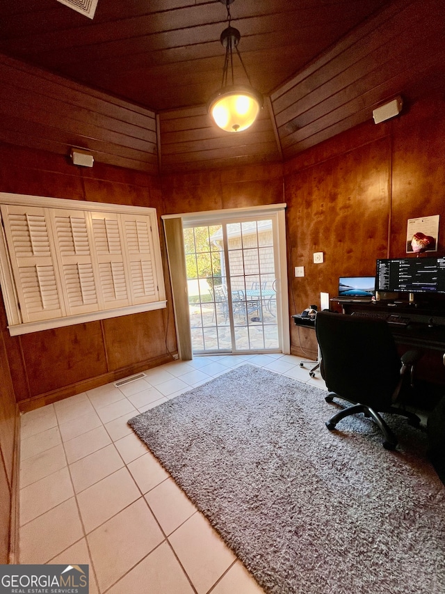 tiled office featuring lofted ceiling, wooden walls, and wooden ceiling