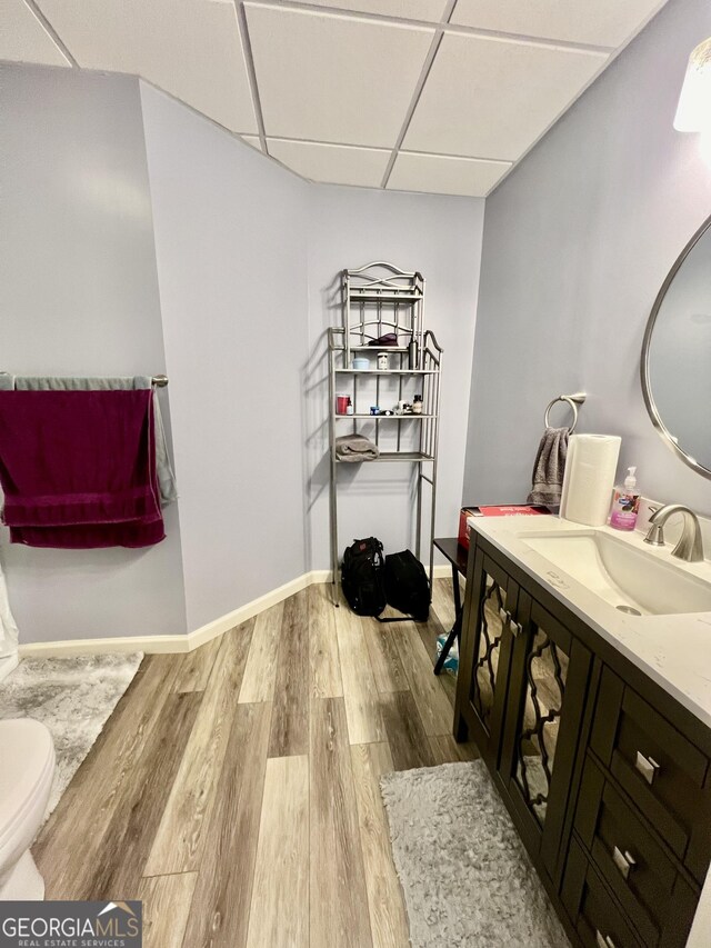 bathroom with vanity, a drop ceiling, and curtained shower