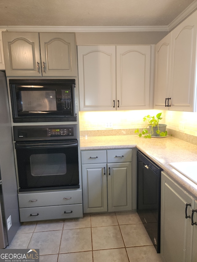 kitchen with white cabinets, crown molding, gray cabinets, light tile patterned flooring, and black appliances