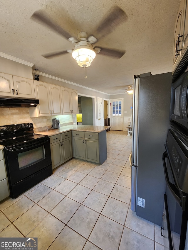 kitchen with kitchen peninsula, tasteful backsplash, ornamental molding, black appliances, and light tile patterned flooring