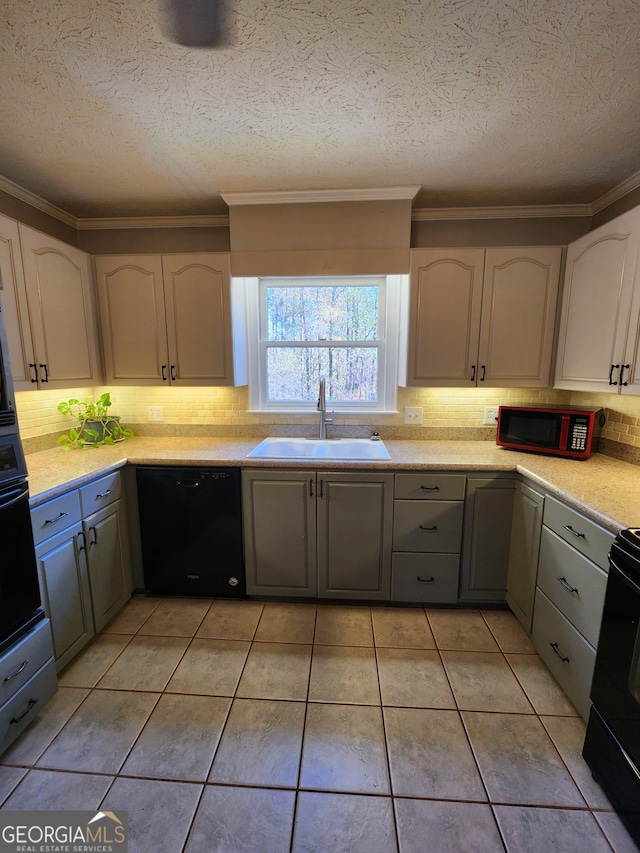 kitchen with black appliances, light tile patterned flooring, gray cabinets, and sink