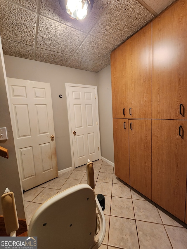 washroom with light tile patterned floors