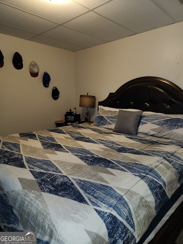 bedroom with a paneled ceiling