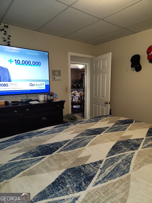 bedroom with a paneled ceiling