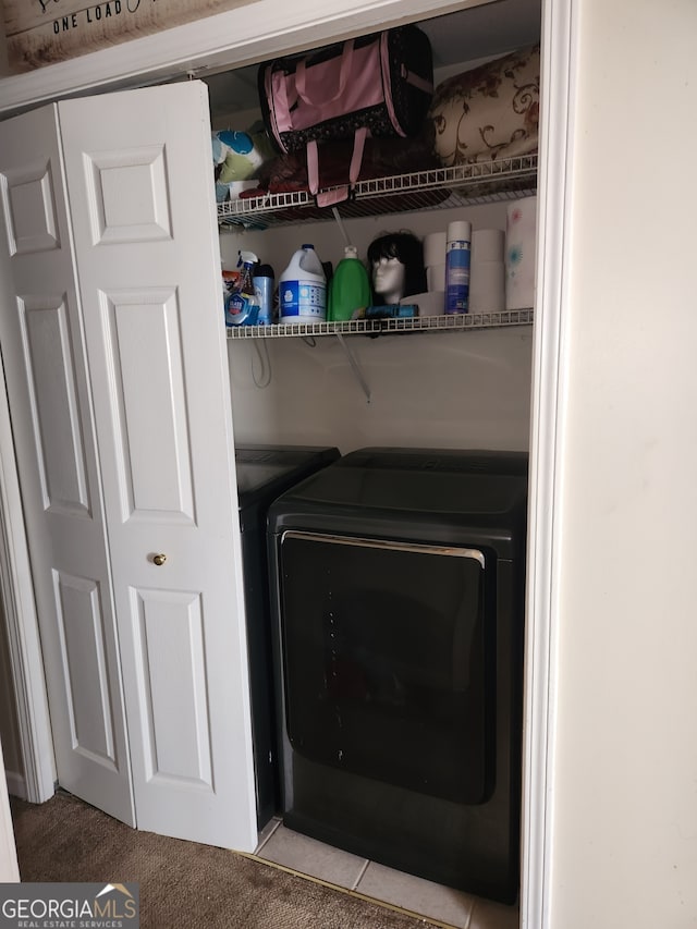 washroom with independent washer and dryer and light colored carpet