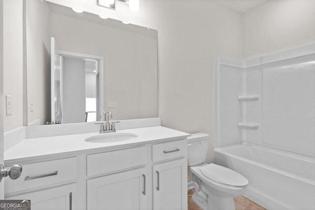 full bathroom with tile patterned flooring, vanity, shower / bath combination, and toilet