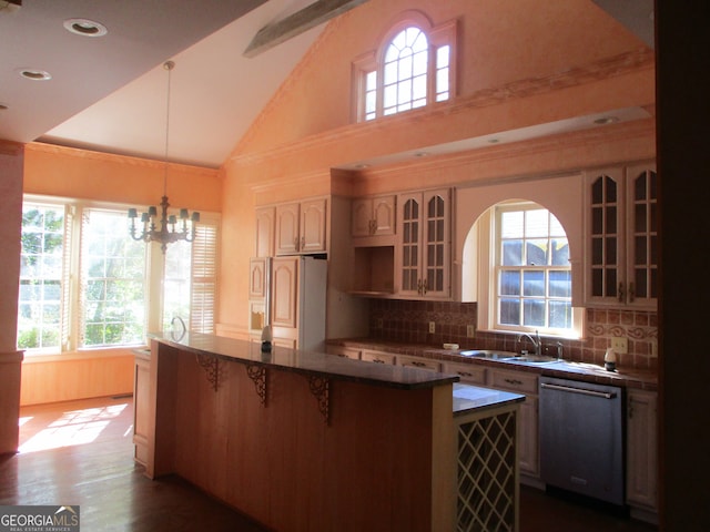 kitchen featuring decorative light fixtures, high vaulted ceiling, dark hardwood / wood-style flooring, sink, and stainless steel dishwasher