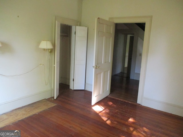 empty room featuring dark hardwood / wood-style floors