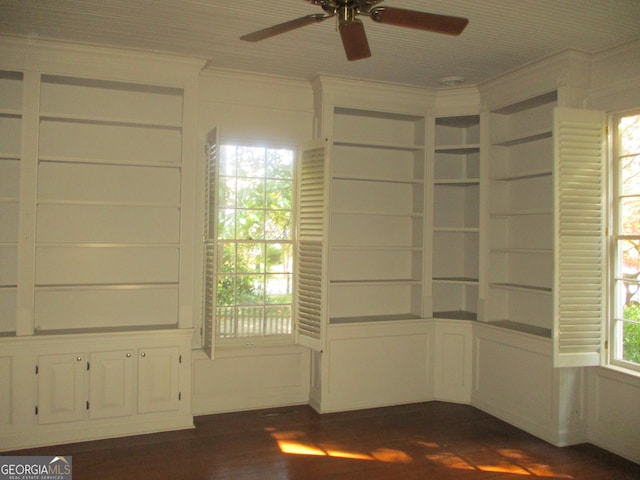 unfurnished room with ceiling fan, dark hardwood / wood-style floors, and crown molding