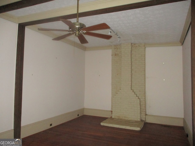 spare room with ceiling fan, a textured ceiling, dark hardwood / wood-style flooring, and crown molding