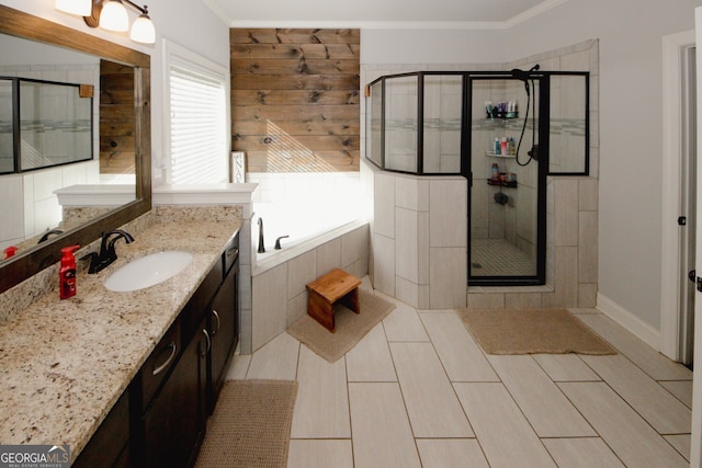 bathroom featuring separate shower and tub, crown molding, and vanity