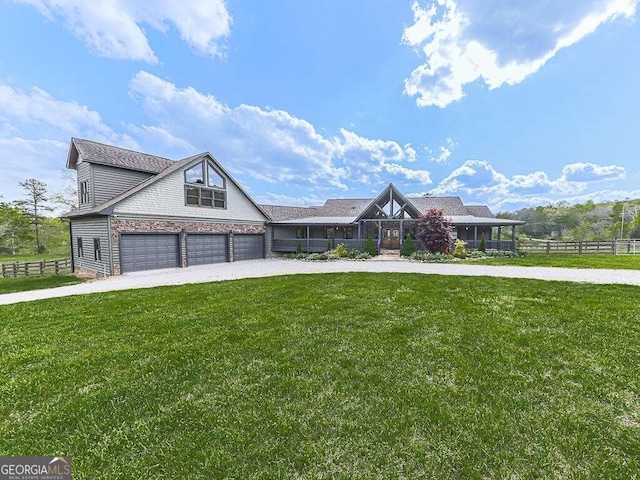 view of front of house featuring a garage and a front yard