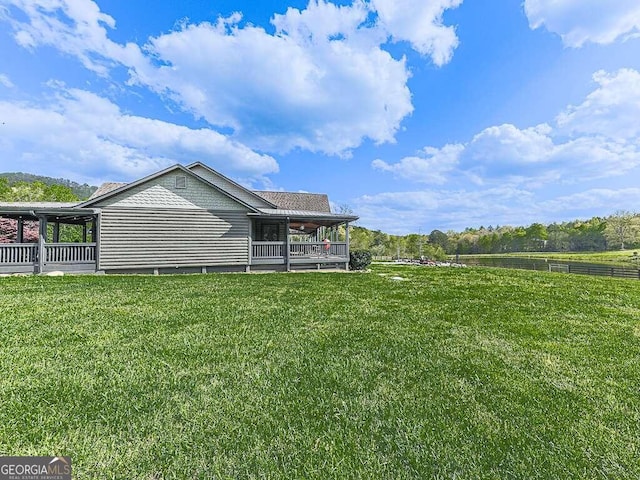 exterior space with a rural view and a lawn