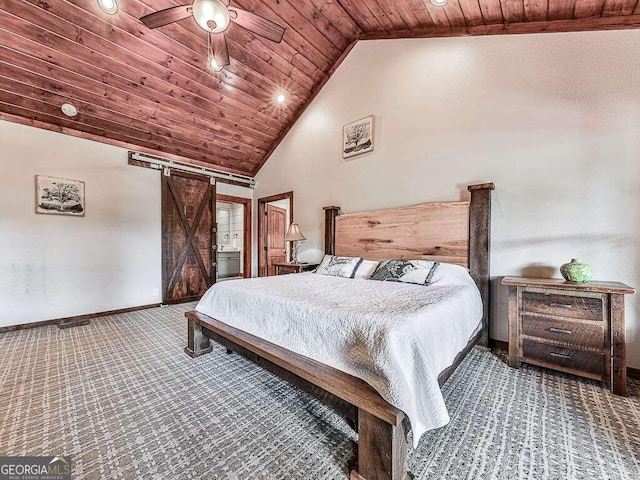 carpeted bedroom with vaulted ceiling, a barn door, ceiling fan, and wood ceiling