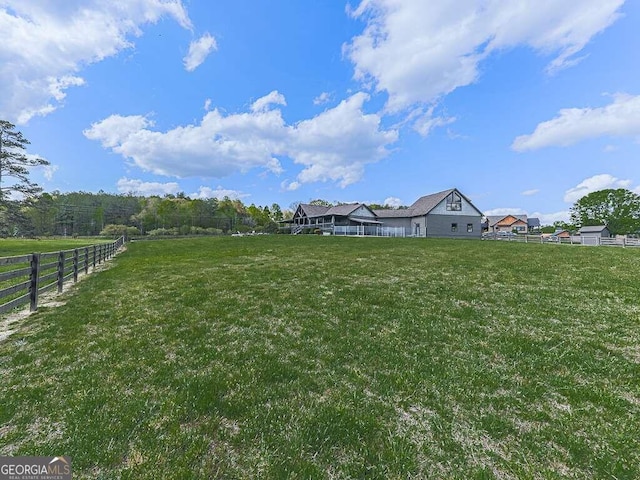 view of yard with a rural view