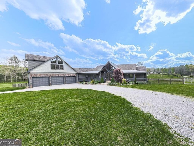 ranch-style home featuring a garage and a front yard