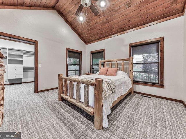 bedroom with wooden ceiling, ceiling fan, vaulted ceiling, and carpet