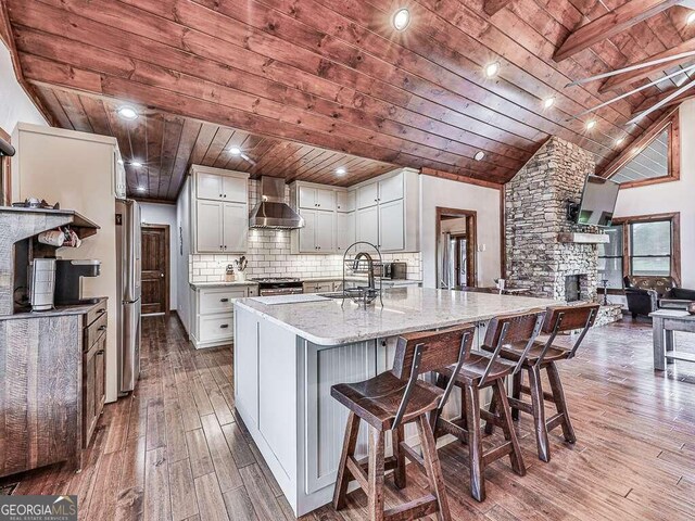 42 Lone Pine Dr, Morganton, GA 30560 - kitchen with wood ceiling, wall chimney exhaust hood, wood-type flooring, a sink, and backsplash