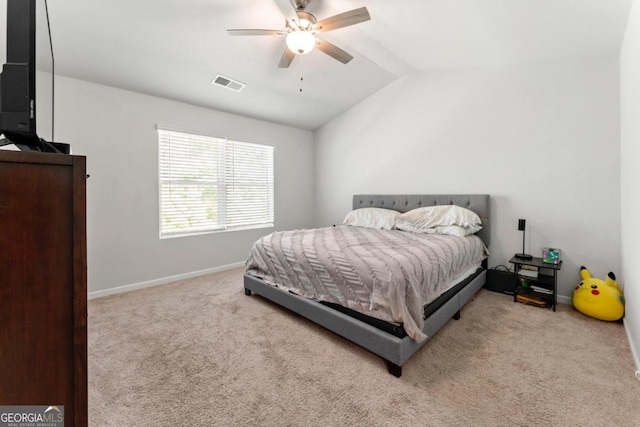 carpeted bedroom with lofted ceiling and ceiling fan