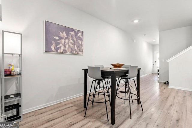 dining area with light hardwood / wood-style floors