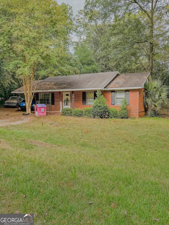 ranch-style house with a front lawn