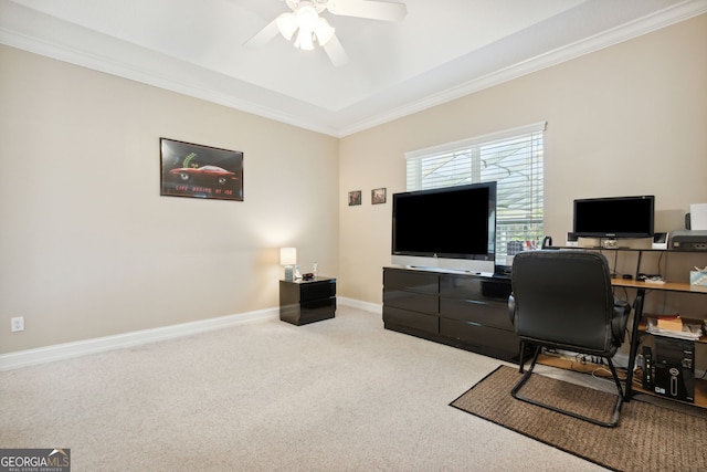 home office with ceiling fan, crown molding, and carpet