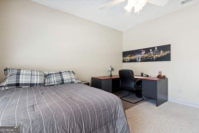 bedroom featuring light colored carpet and ceiling fan