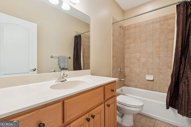 full bathroom featuring toilet, vanity, shower / bath combo with shower curtain, and tile patterned floors